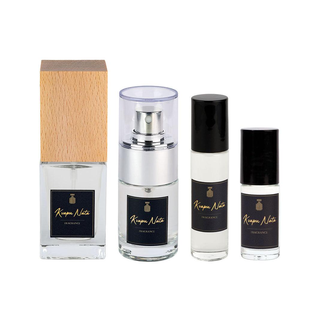Stylish collection of four elegant perfume bottles featuring a wooden and sleek design, perfect for sophisticated fragrance lovers.
